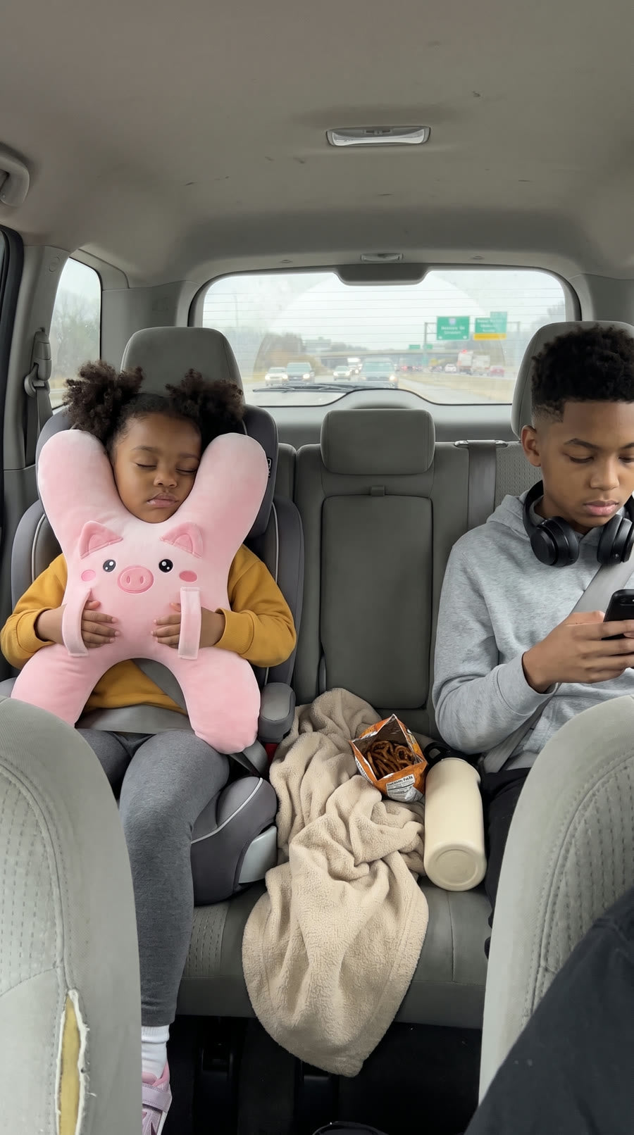 Kids sleeping with DozyRide on the go