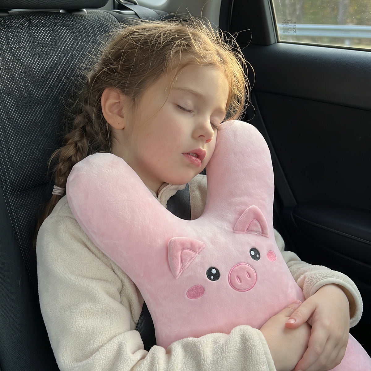 Child sleeping upright in the car with DozyRide